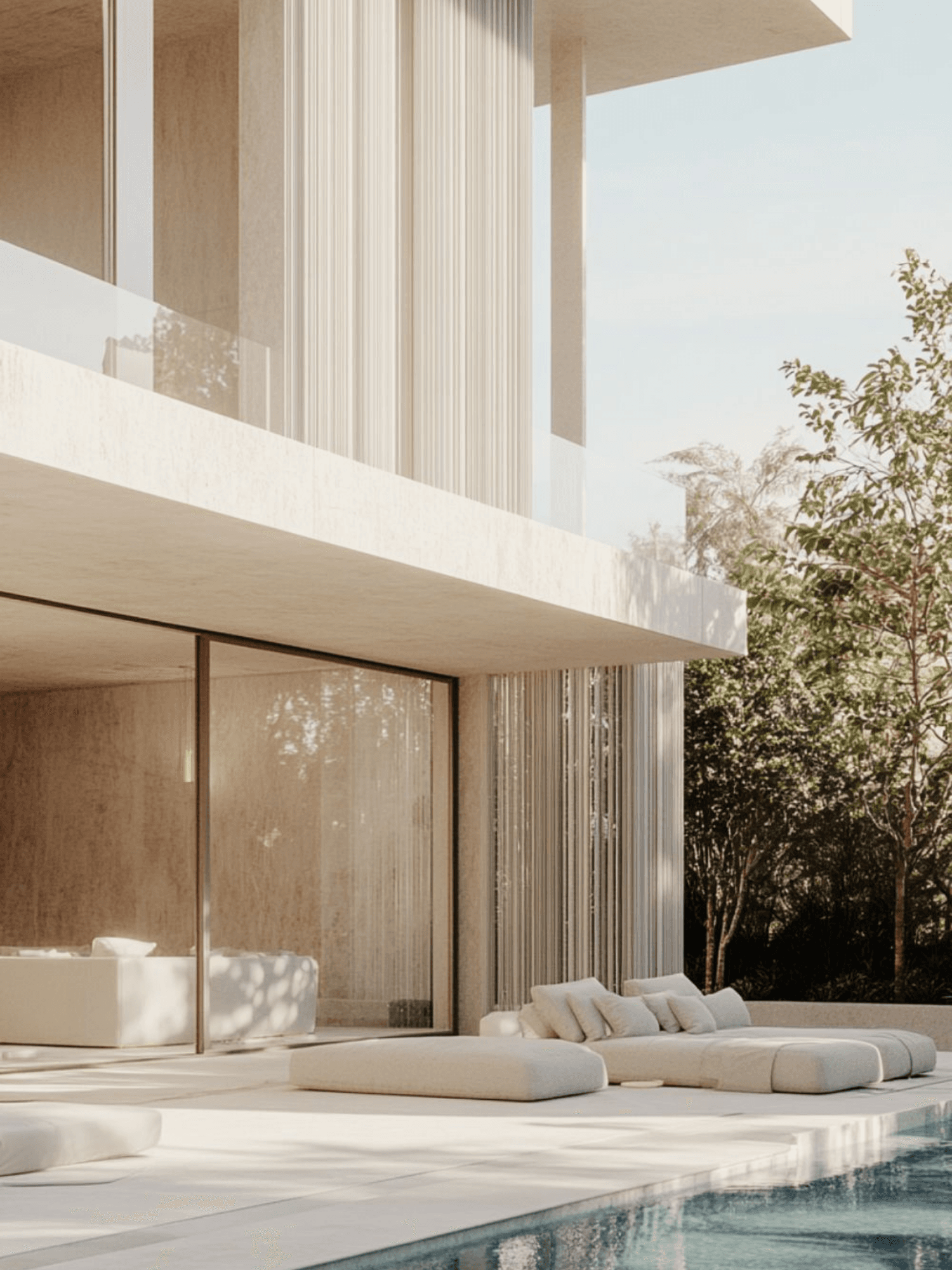 Villa exterior with pool loungers