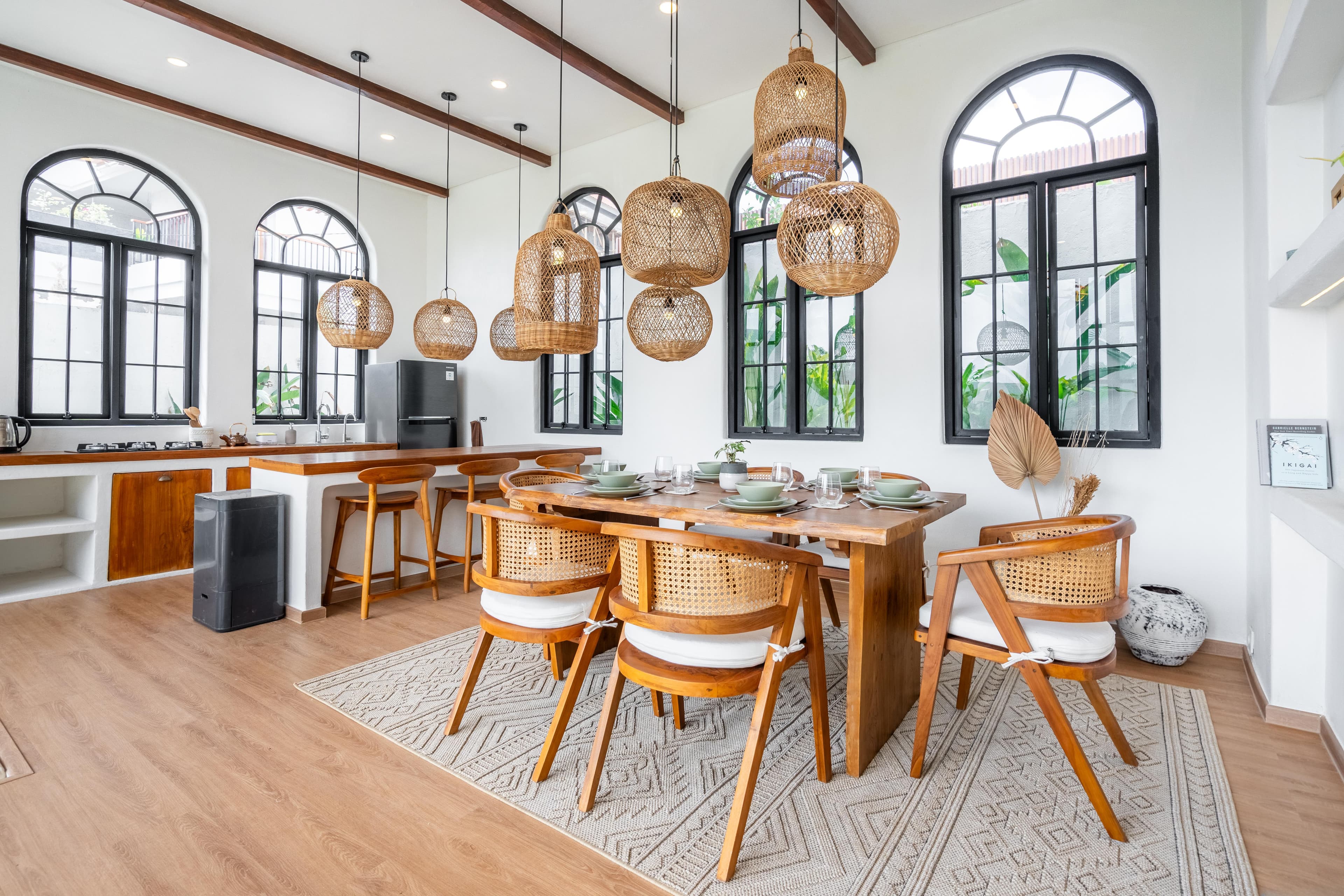 Palm Sugar Villa — open-plan dining and kitchen with rattan pendant lights, Jimbaran Bali