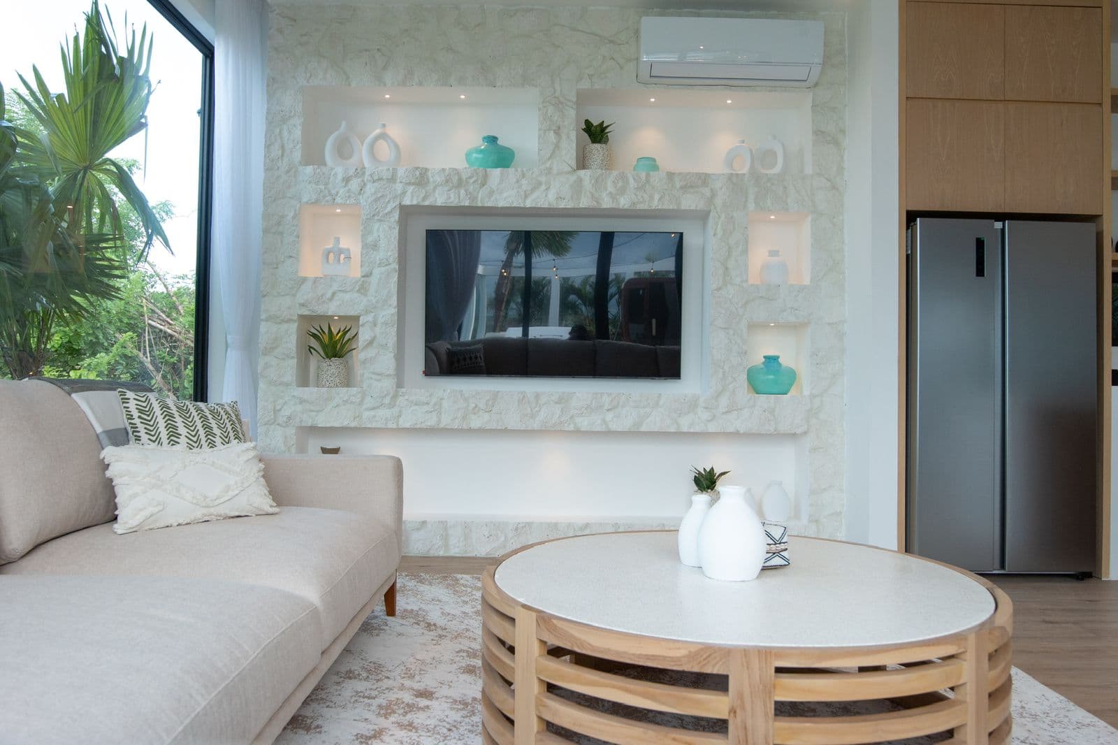 The Cottage — lounge with stone feature wall