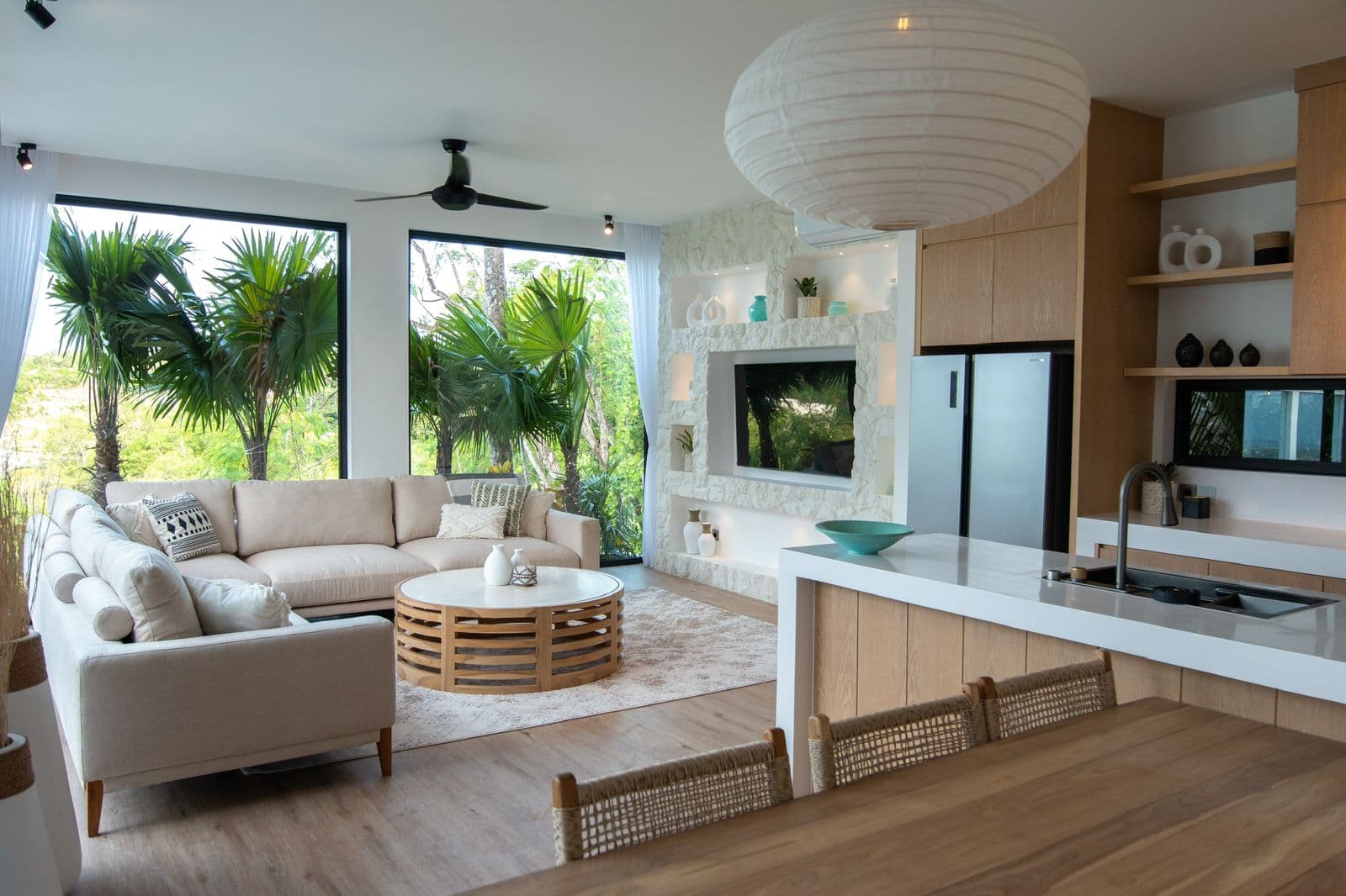 The Cottage — living and kitchen with lush garden views