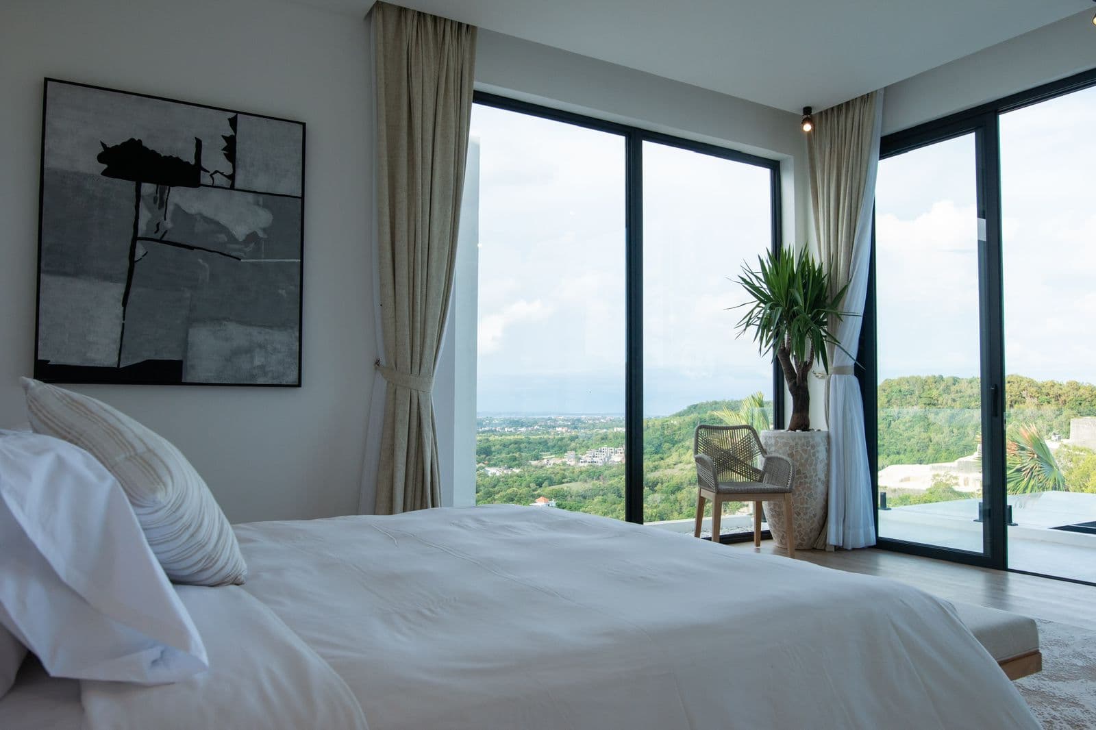 The Cottage — master bedroom with panoramic hill views