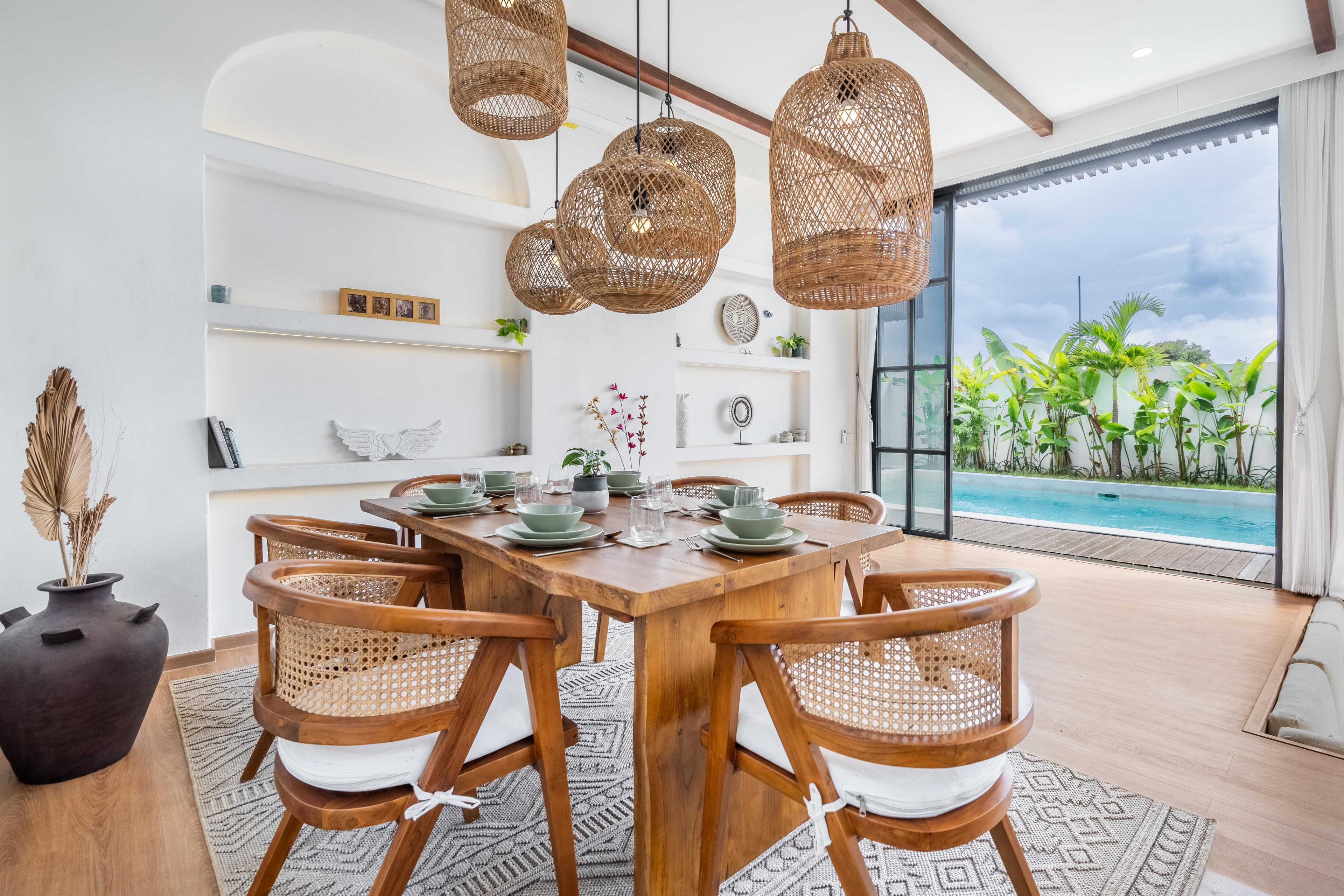 Palm Sugar Villa — dining area opening onto the pool and garden