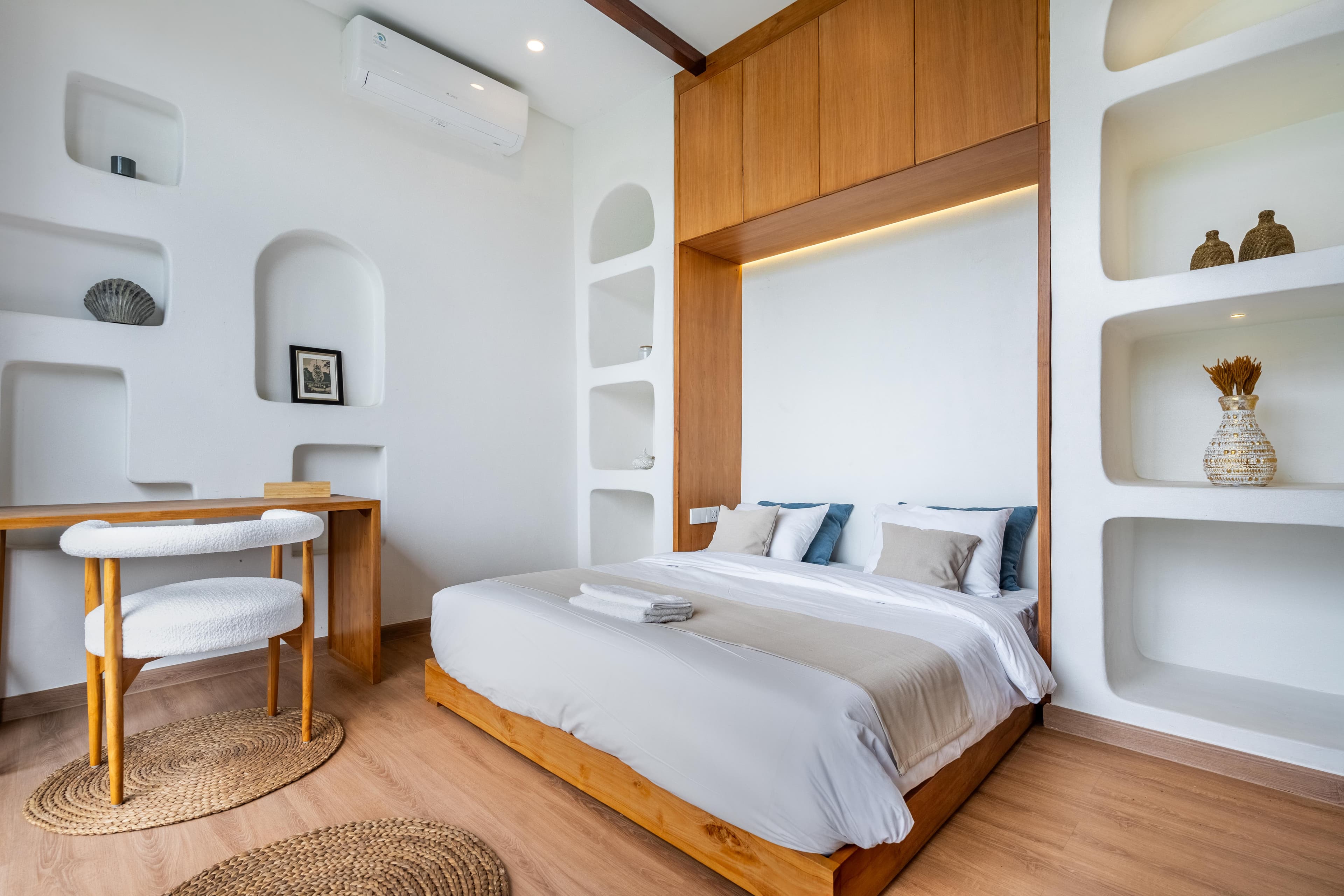 Palm Sugar Villa — bedroom with built-in wood headboard and storage